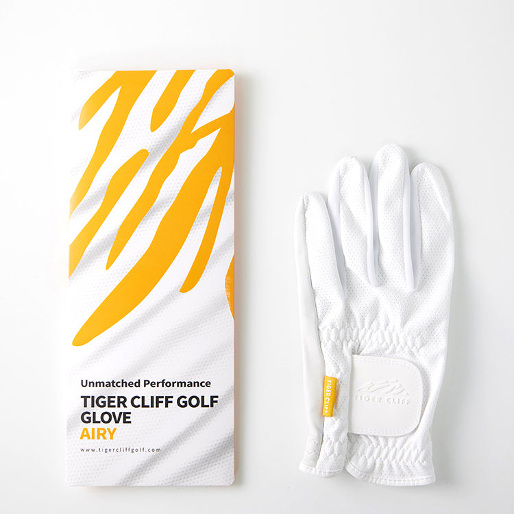 Tiger Cliff Gloves - Airy, white golf glove next to its packaging with yellow stripes.