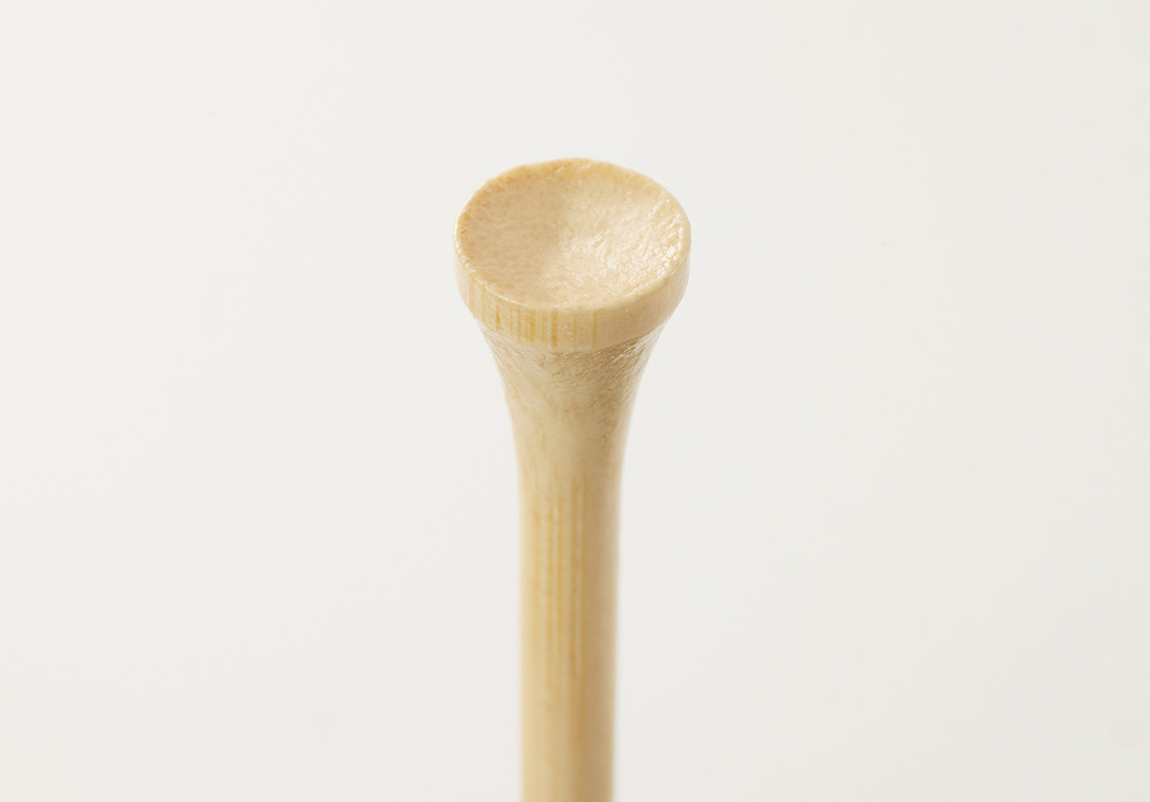 Wooden spoon on a white background