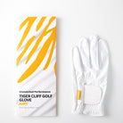 Tiger Cliff Gloves - Airy, white golf glove next to its packaging with yellow stripes.