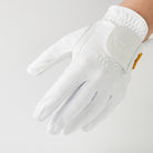 Hand wearing a white, perforated Tiger Cliff Gloves - Airy.