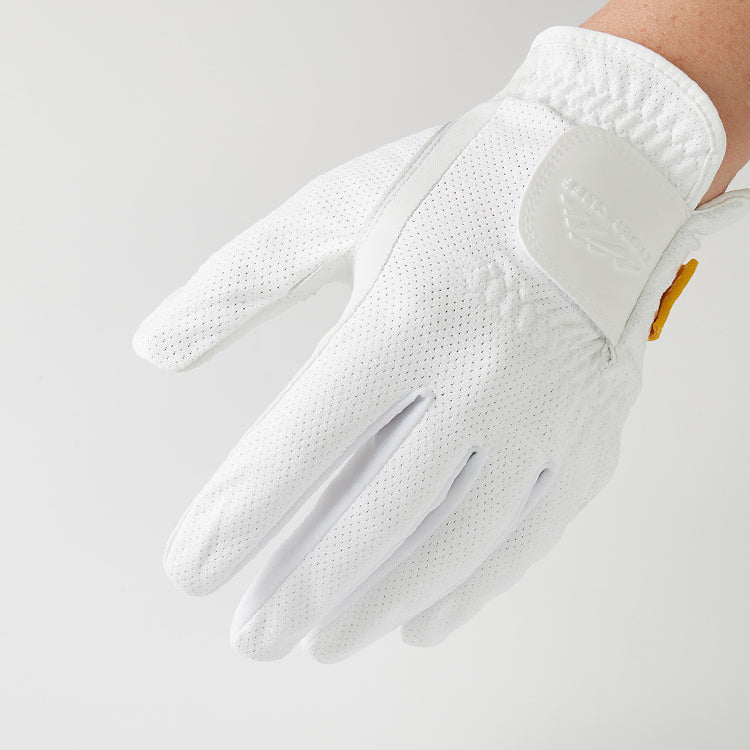 Hand wearing a white, perforated Tiger Cliff Gloves - Airy.