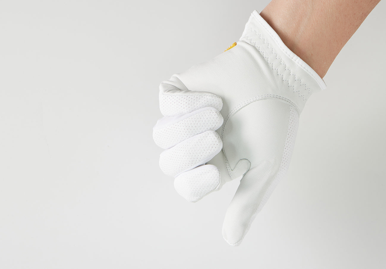 Hand wearing AIRY_2.jpg white glove, thumb pointed down on a white background.