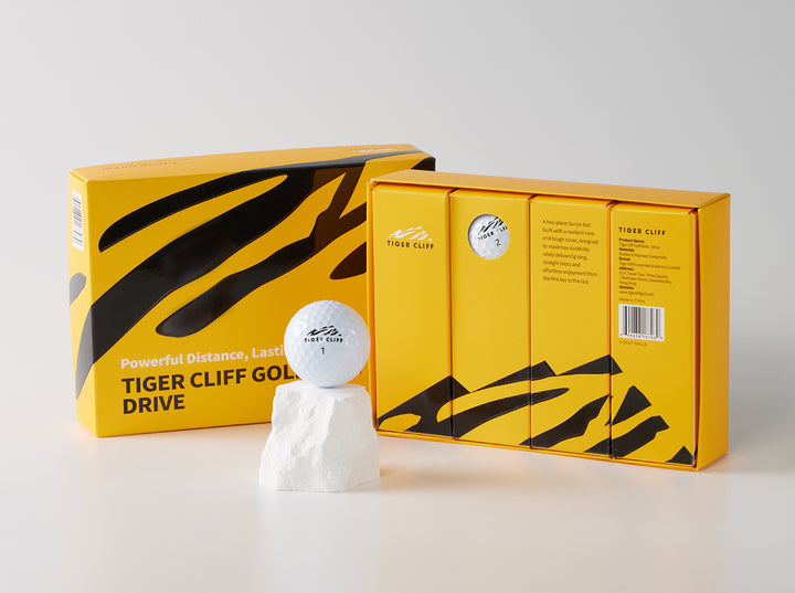 Tiger Cliff Drive golf ball and box on display.