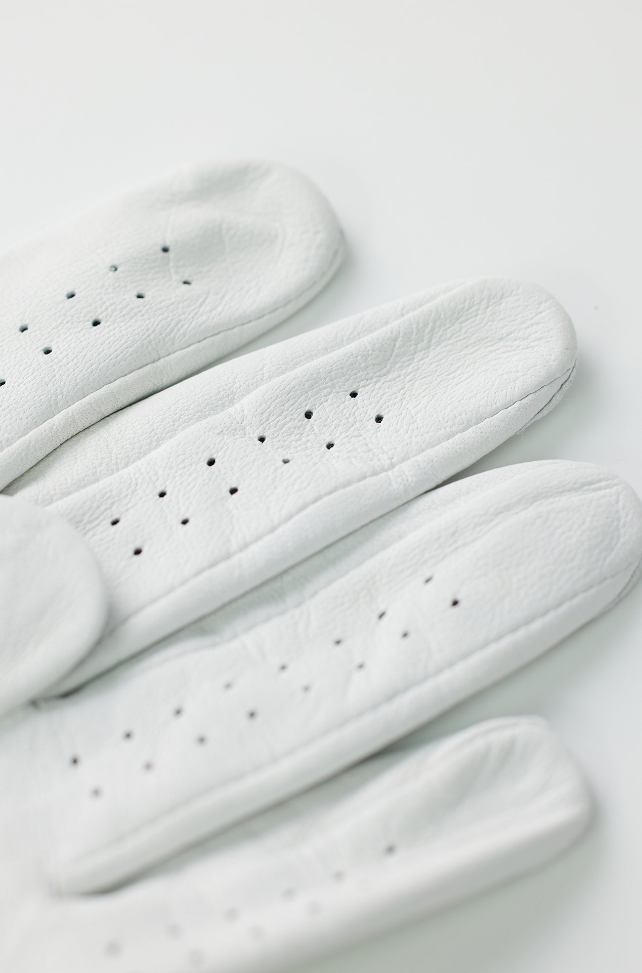 Close-up of LAMBSKIN_4.jpg glove showing perforated finger details.