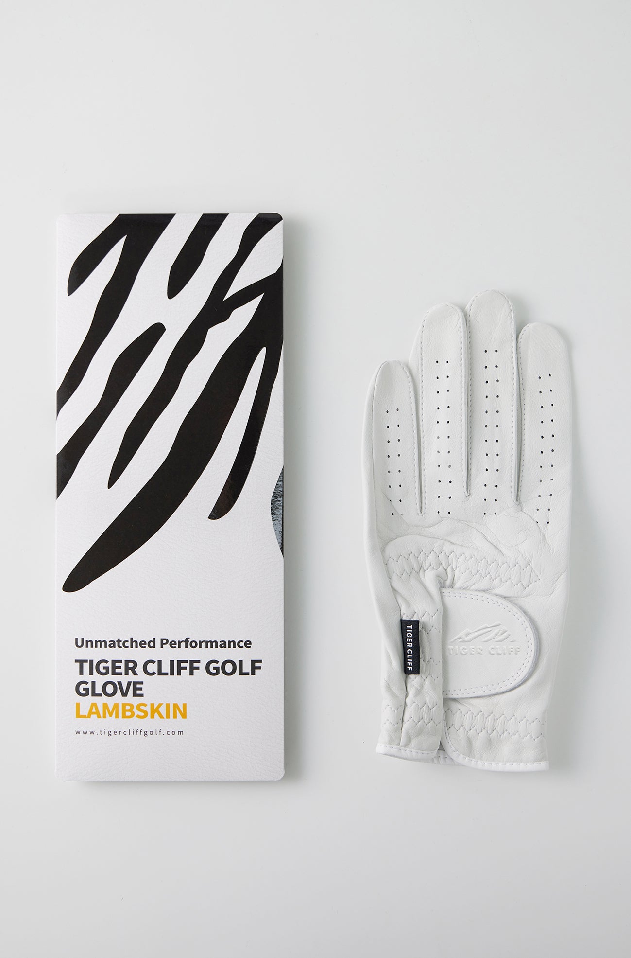 Tiger Cliff Golf Glove LAMBSKIN with packaging and white leather glove.