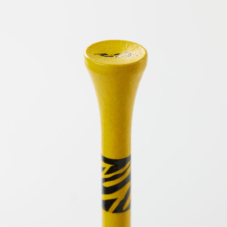 Close-up of a yellow Tiger Cliff Tee - Wood with black stripes.