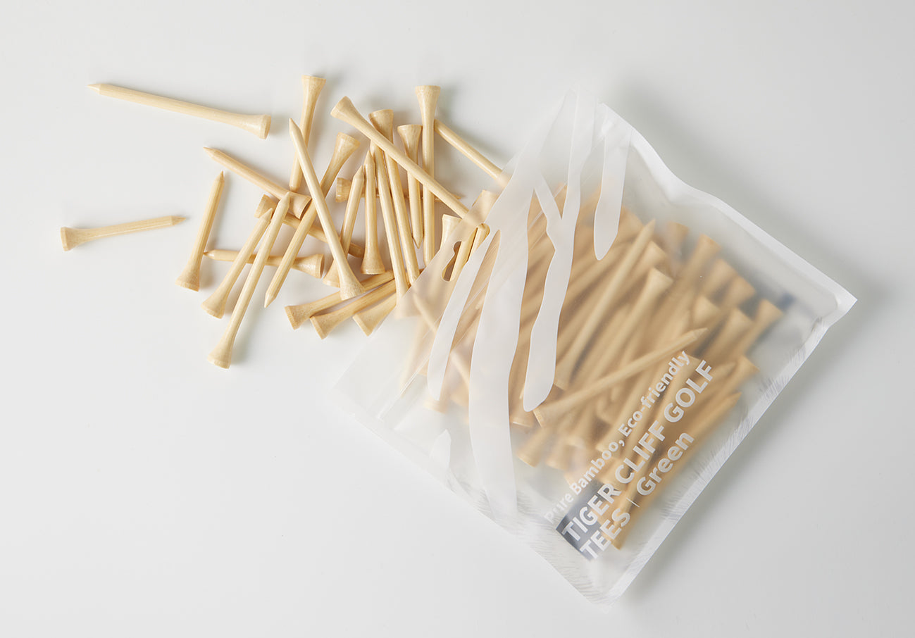 TEE_W3.jpg: Tiger Cliff Golf Tees in packaging with some scattered around.